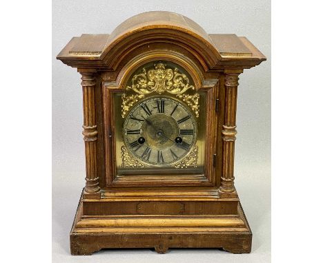 GERMAN WALNUT CASE MANTEL CLOCK, late 19th Century with dome top, reeded three quarter columns flanking the glazed door, arch