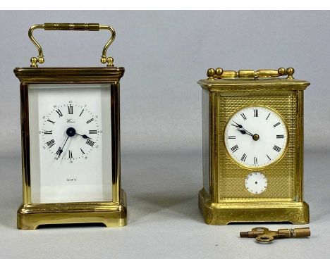 GILT BRASS CASED CARRIAGE CLOCK, having circular enamel dial with Roman numerals, subsidiary alarm dial, eight day repeat str