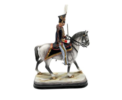 Limited edition, 14 of 50, hand painted military figure of a British cavalry officer on a gray horse. Sword in hand. Gold acc