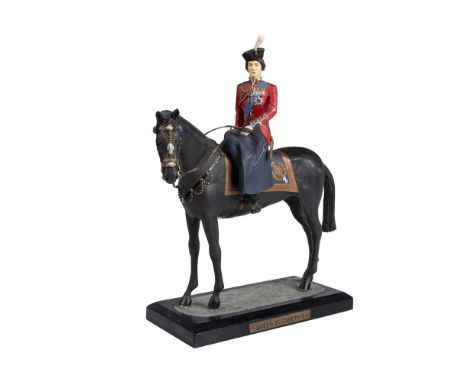 Hand modelled and hand painted figure of the late Queen of England in her British army uniform, and on a black horse. Attache