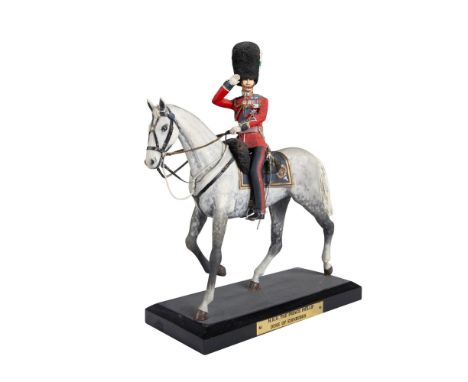 Hand modelled and hand painted figure of H.R.H. The Prince Phillip Duke of Edinburgh in his British army uniform, and on a gr