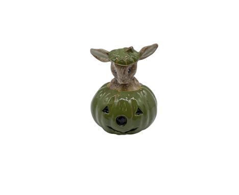 DB132. Hand modelled and hand painted figure of a silly Bunnykin popping out of a squash-green jack-o-lantern. Royal Doulton 