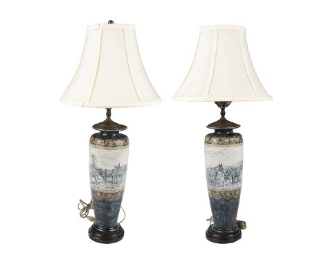 Two beautiful antique hand decorated and hand painted pottery lamps with wooden bases, and brass lamp caps. The body of the l