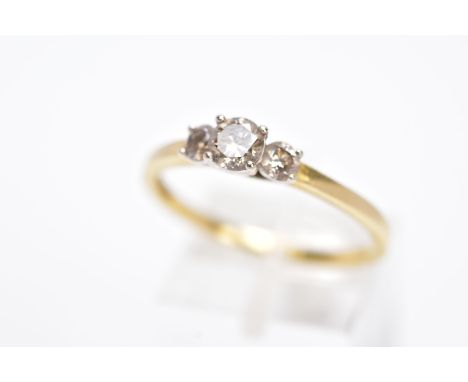 AN 18CT GOLD THREE STONE DIAMOND RING, designed with three graduated claw set, brilliant cut diamonds, total estimated diamon