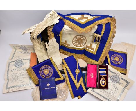 A BOX OF MASONIC REGALIA, a metal case with contents such as a cased yellow metal and blue enamel medal, of an oval form 'Sta