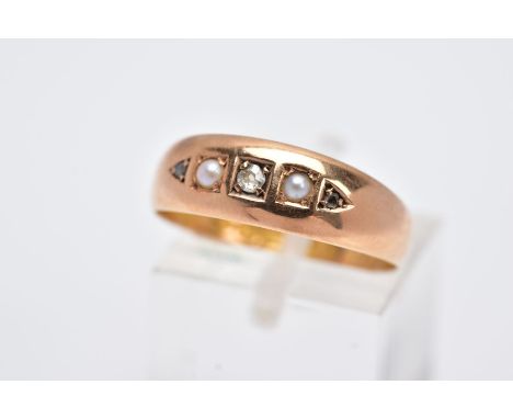 A LATE 19TH CENTURY 15CT GOLD FIVE STONE RING, designed with a row set with a central single cut diamond, flanked with split 