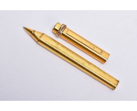 A GOLD PLATED CARTIER BALL POINT PEN, of an engine turn design, twisted tri-coloured detail to the lid, signed 'Cartier' Pari