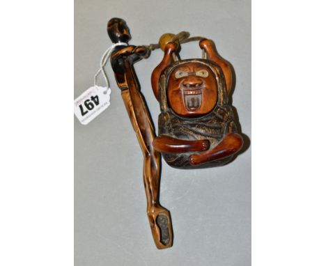 A JAPANESE TOBACCO BOX AND FIGURAL PIPE HOLDER, the pipe holder shaped as an elongated man, length 20cm and the tobacco box i
