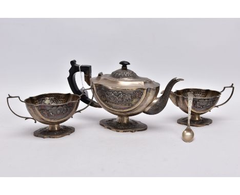 AN EARLY 20TH CENTURY THREE PIECE TEA SET, to include a teapot fitted with a wooden scroll detailed handle, embossed design d