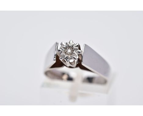 A 9CT WHITE GOLD SINGLE STONE DIAMOND RING, designed with an illusion set, single cut diamond, in a raised gallery, plain pol