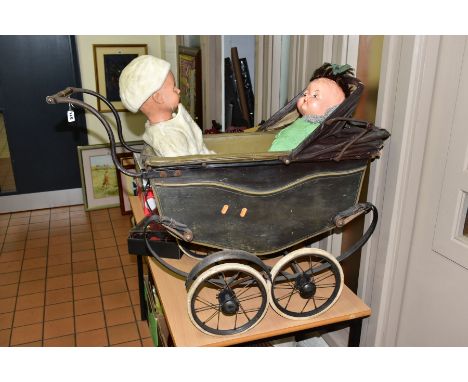 A VINTAGE DOLLS PRAM, appears complete but in need of restoration, wooden body with canvas folding hood on metal chassis with