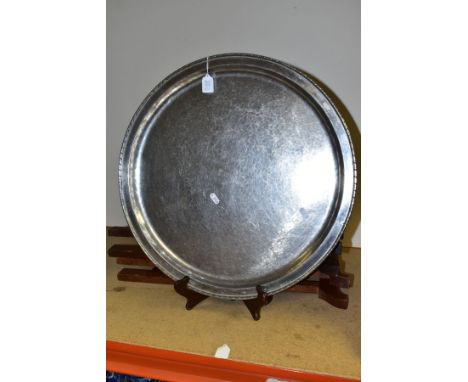 A PAIR OF KESWICK SCHOOL OF INDUSTRIAL ART FIRTH STAYBRIGHT CIRCULAR STEEL TRAY TOP TABLES, rope effect rims, hand hammered s