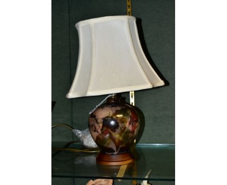 A COBRIDGE STONEWARE TABLE LAMP OF GLOBULAR FORM, a cream fabric shade above the ceramic base decorated with abstract designs