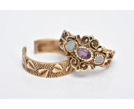 TWO 9CT GOLD RINGS, the first of a three stone design set with a central oval cut amethyst, flanked with worn opal cabochons 