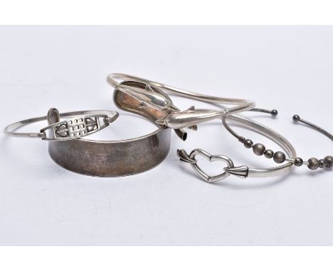 A BAG OF ASSORTED SILVER AND WHITE METAL BANGLES, the first silver bangle in the form of two overlapping dolphins, hallmarked