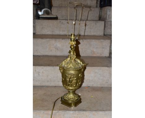 A LATE 19TH CENTURY ORMOLU TABLE LAMP OF URN FORM, with seated Putti holding a garland and flowers above a domed top with aca