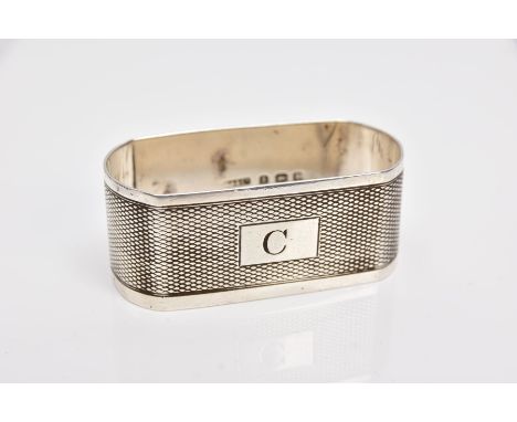 A SHAPED RECTANGULAR SILVER NAPKIN RING, engine turned decoration, initial C engraved to cartouche, weight 22.5 grams, 0.72oz
