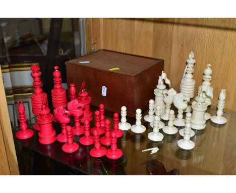 A 19TH CENTURY CARVED BONE SET OF CHESS PIECES, one half stained red, height king 14cm, with a baise lined box, lid bearing i
