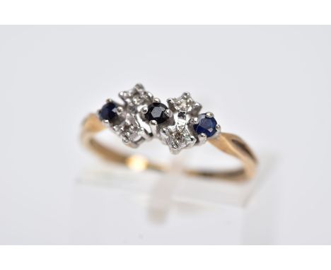 A 9CT GOLD SAPPHIRE AND DIAMOND RING, designed with a row of circular cut blue sapphires interspaced with single cut diamond 