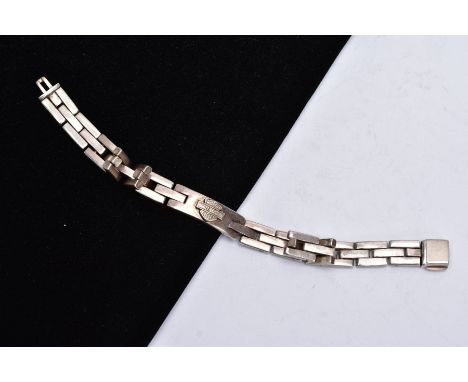 A 'HARLEY DAVIDSON' WHITE METAL BRACELET, designed as an identification bracelet set with a Harley Davidson emblem, on a curb