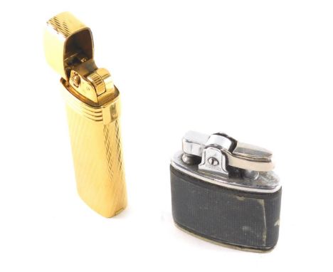 A Christian Dior pocket lighter, the rectangular body with a raised line decoration, and a further Ronson pocket lighter. (2)