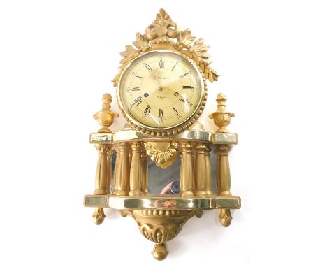 Holmia Stockholm. A 20thC wall clock, with 17cm diameter Roman numeric and Arabic dial, surmounted by pierced scrolls and flo