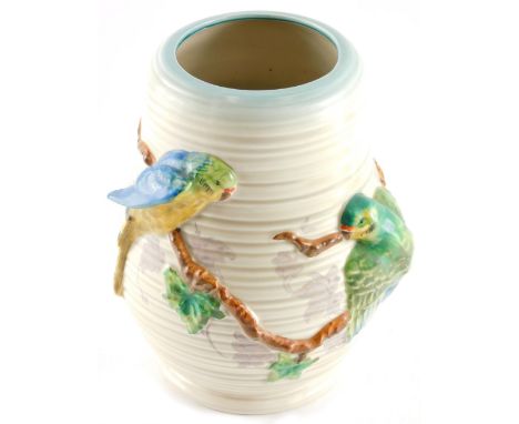 A 1950's Clarice Cliff Newport pottery jug, raised with Budgerigars and branches, printed marks beneath, 24cm high.