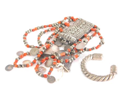 An Indian necklace, with elaborate rectangular centre, set with strings of orbs some in orange stones and  hung with 1/4 rupe