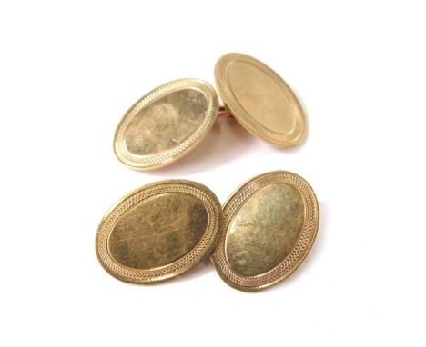 A pair of 9ct gold cufflinks, each oval with engine turned outer border, with chain links, 3.6g all in.