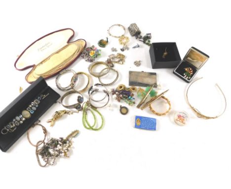 Various costume jewellery, comprising torc bangles, tiaras, plated cigarette case, stone set bangle, gold coloured brooches, 