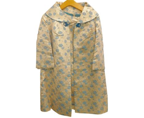 A vintage ladies evening suit, in gold and blue floral fabric, label for Macway's Tailors of Kowloon Hong Kong.