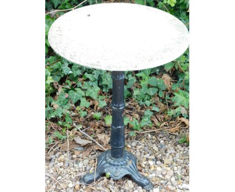 A cast iron garden table with circular white marble top, 49cm diameter.