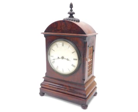 A Victorian mahogany bracket clock, the arched top with a turned and gadrooned finial above a painted dial, with 7 day moveme