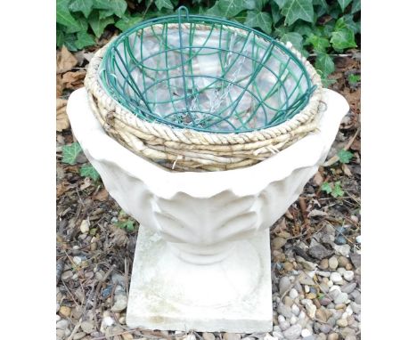 A composite stone garden urn, 38cm high, and various hanging baskets.