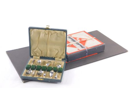 A set of six George V silver teaspoons, old English pattern Sheffield, 1920, 8cm wide, cased, 2.1 oz and a vintage Monopoly s