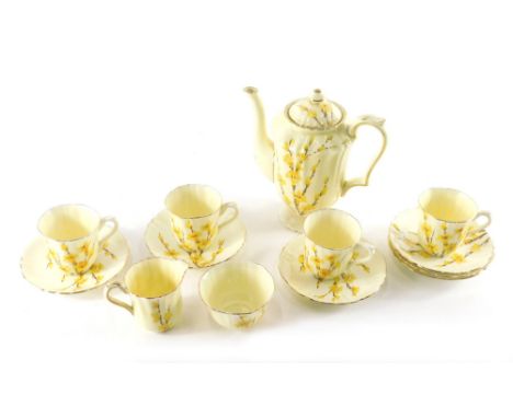 An early 20thC Crown Staffordshire part service, to include coffee pot 20cm high, cups, saucers, milk jug and sugar bowl, dec