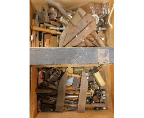 A collection of vintage wood working and other tools, to include wooden block planes, chisels, etc. (2 boxes)