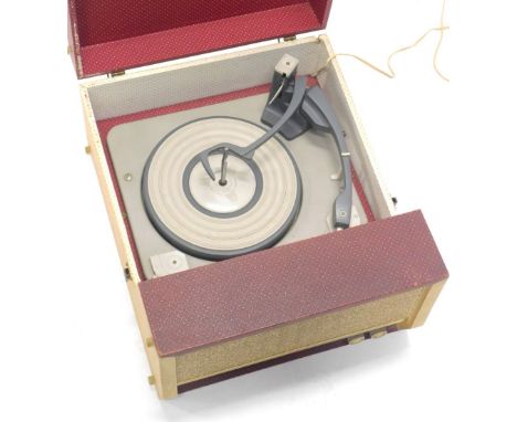 A 1960's vintage Falcon record player, with plastic turntable, tuning knops and grill to the front, in fitted case, 38cm wide
