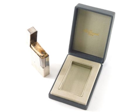 A Dupont pocket lighter, the rectangular body with a raised line decoration with side cylindrical striker, marked beneath, 6c