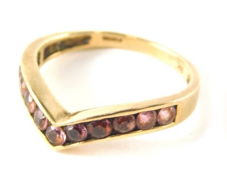 A 9ct gold wishbone ring, set with faceted light pink stones, ring size T½, 3.1g all in.
