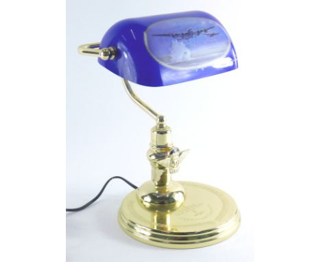 An Operation Chastise reproduction table lamp, with blue shade, on circular foot, 32cm high. 