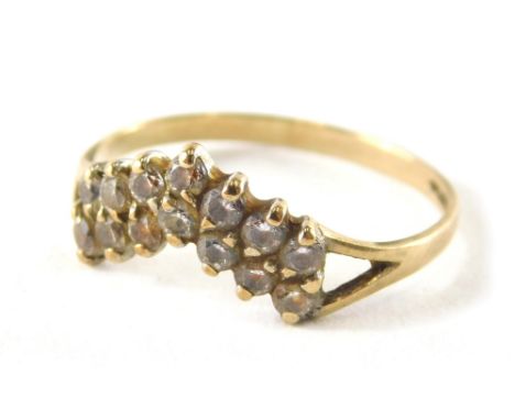 A 9ct gold diamond set dress ring, the wish bone design of two layers set with tiny diamonds with V splayed shoulders, ring s