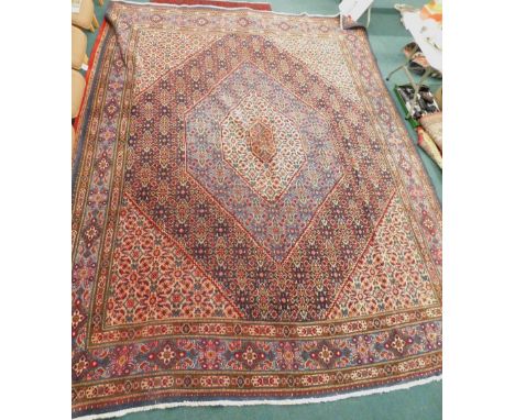 A large vintage Ardabil Persian carpet, with geometric design in cream, shades of blue, etc., with multiple borders, 400cm x 