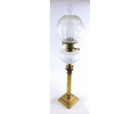 A late 19th/early 20thC oil lamp, with clear and opaque etched shade and a cut glass reservoir on a brass corinthian column b