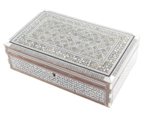 A 20thC Indian mother of pearl jewellery box, Bombay type with an elaborate inlay of flowers, with an outer line and floral b