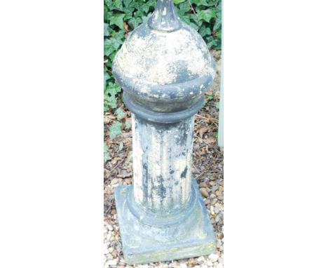 A composition pillar shaped finial, 84cm high.