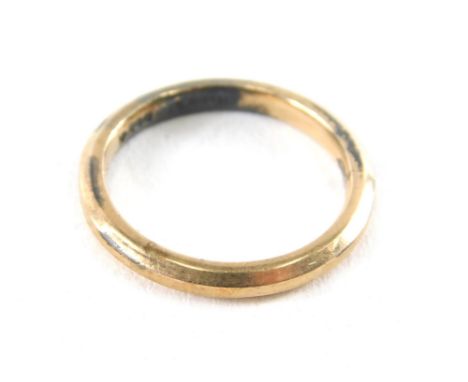 A wedding band, of plain design, yellow and white metal stamped 9ct gold on silver, ring size K, 2.2g all in.