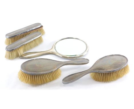 A George V silver dressing table set, by the Adie brothers, to include hand mirror, 25cm high, partially engine turned, Birmi