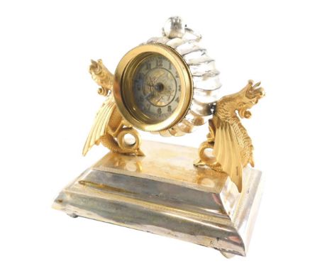 A travel clock, on silver plated stand, with an articulated and adjustable pocket watch centre with 5cm diameter dial, held b