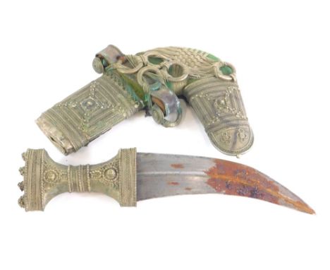 A highly elaborate Eastern Jambiya ornamental dagger and scabbard, highly decorated with raised orbs and flower heads, on a m